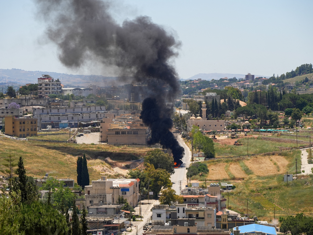 A vehicle burns after being hit in an Israeli air strike in southern Lebanon. Photo: Reuters