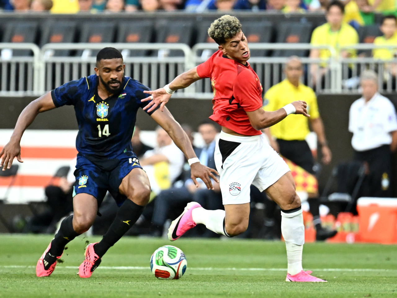 Egypt's Emam Ashour in action with Brazil's Bremer. Photo: Reuters