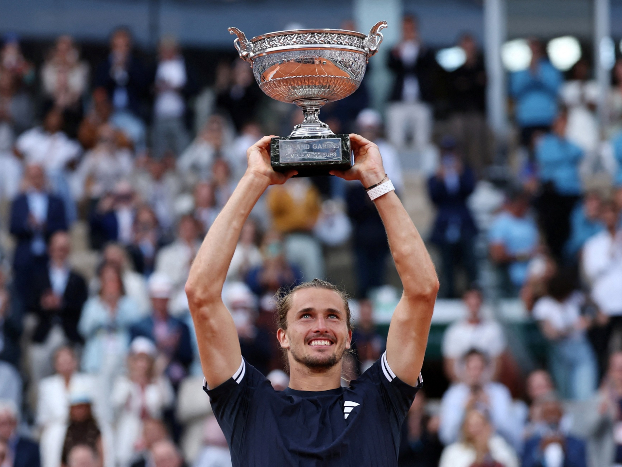 Germany's Alexander Zverev celebrates with the trophy after winning the final against Italy's Flavio Cobolli. Photo: Reuters