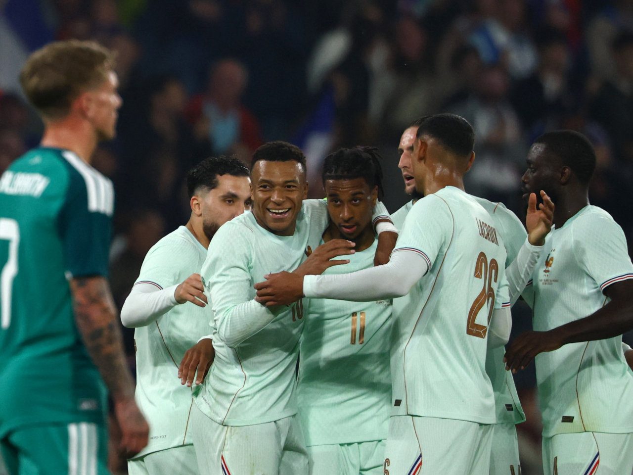 France players celebrate after Michael Olise bags a hat-trick against Northern Ireland. Photo: Reuters