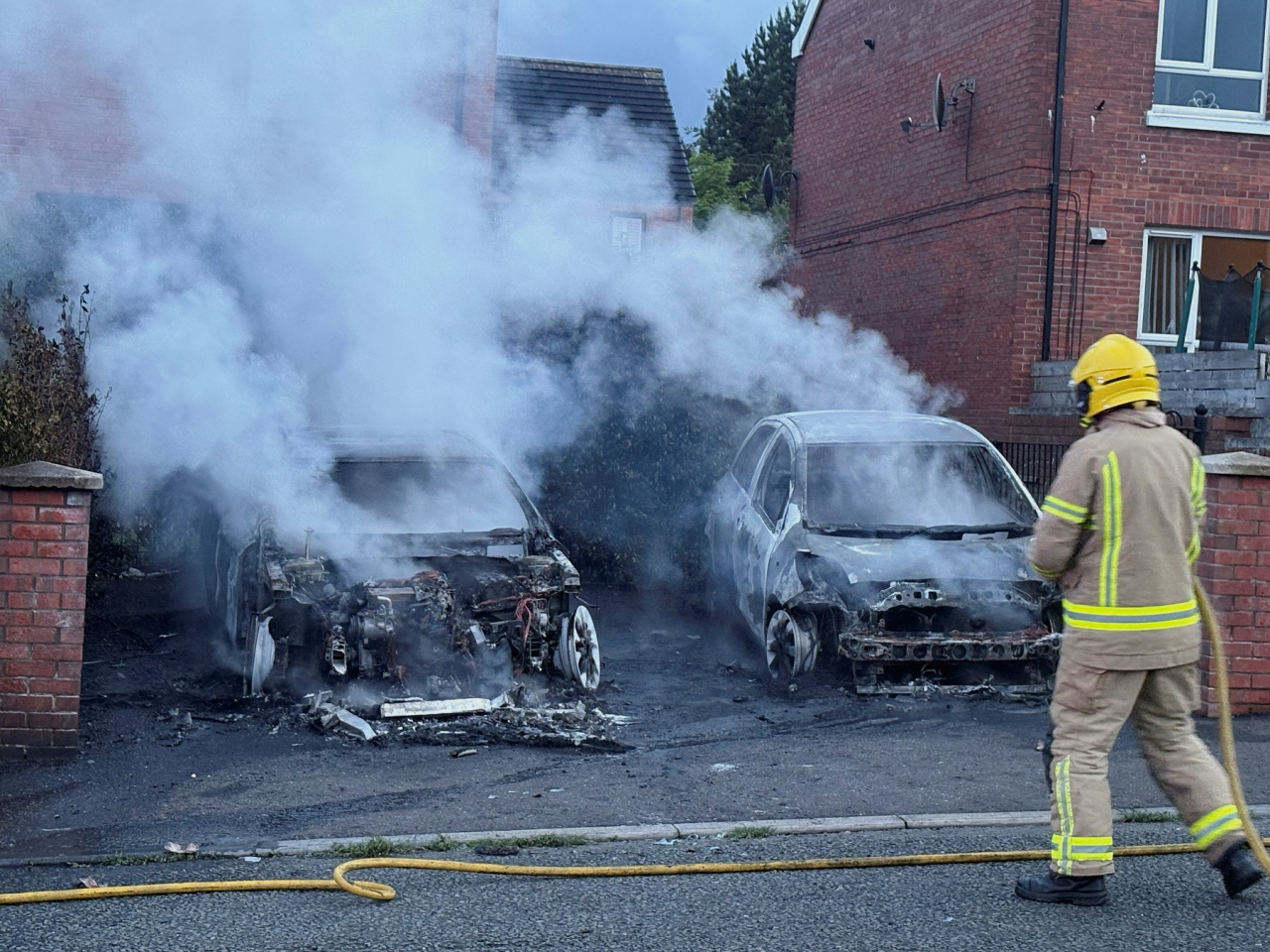 A firefighter works to extinguish a fire in Belfast after during a protest after anti-immigration protesters torched buildings and vehicles in response to a knife attack on Tuesday. Photo: Reuters