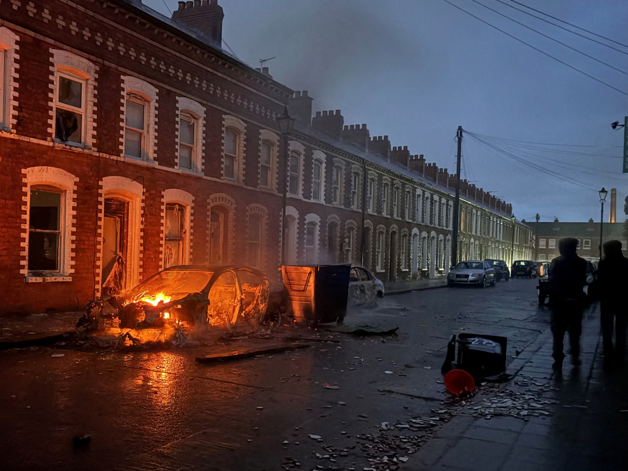Cars were set alight on the streets of Belfast, after the alleged stabbing attack by a Sudanese refugee triggered violent protests. Photo: Reuters