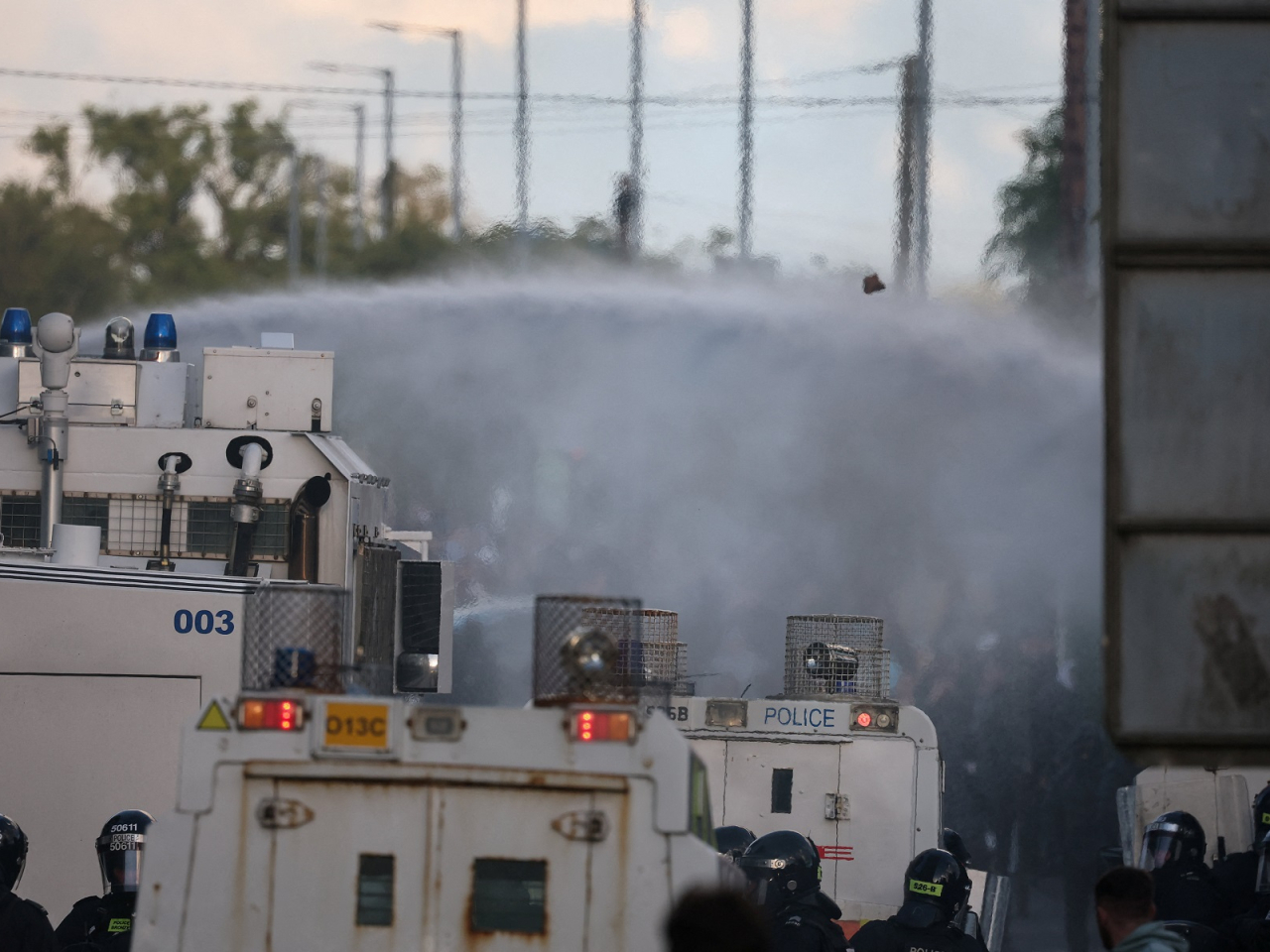 Police used a water canon on anti-immigrant protesters in Belfast. Photo: Reuters