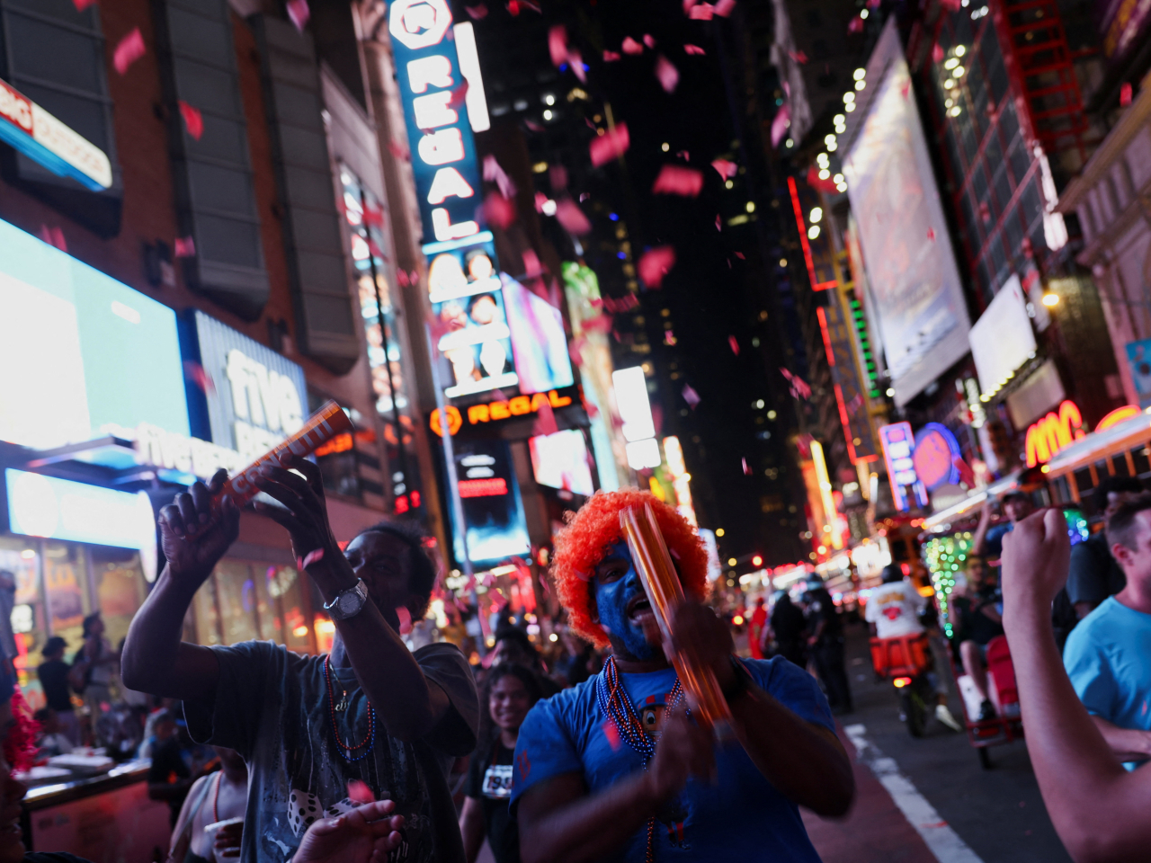 Fans celebrate in downtown New York City after the Knicks' historic win. Photo: Reuters