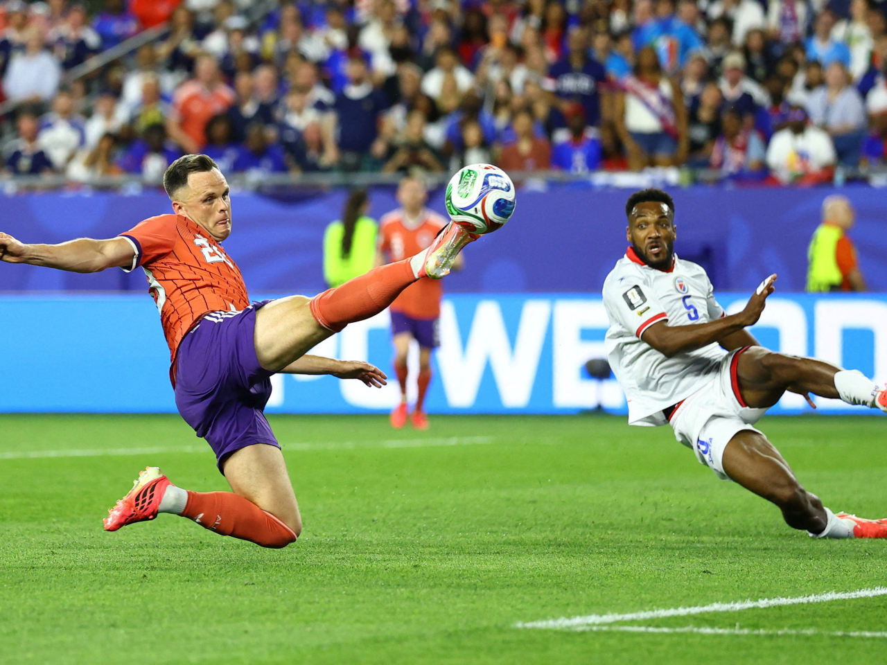 Scotland's Lawrence Shankland in action with Haiti's Hannes Delcroix. Photo: Reuters
