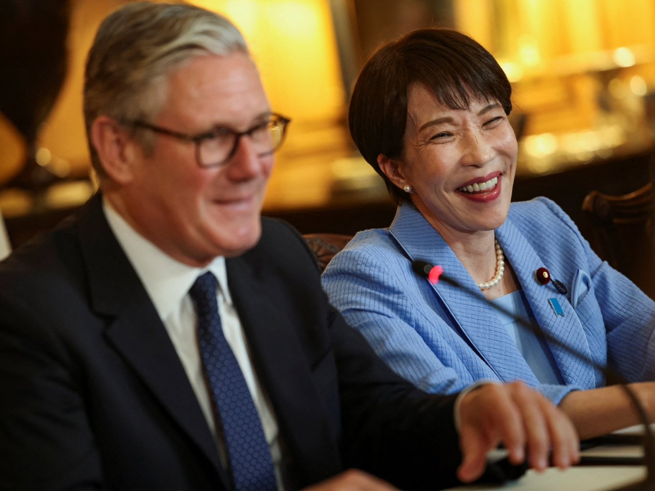 Keir Starmer and Sanae Takaichi attend a business roundtable meeting in London. Photo: Reuters