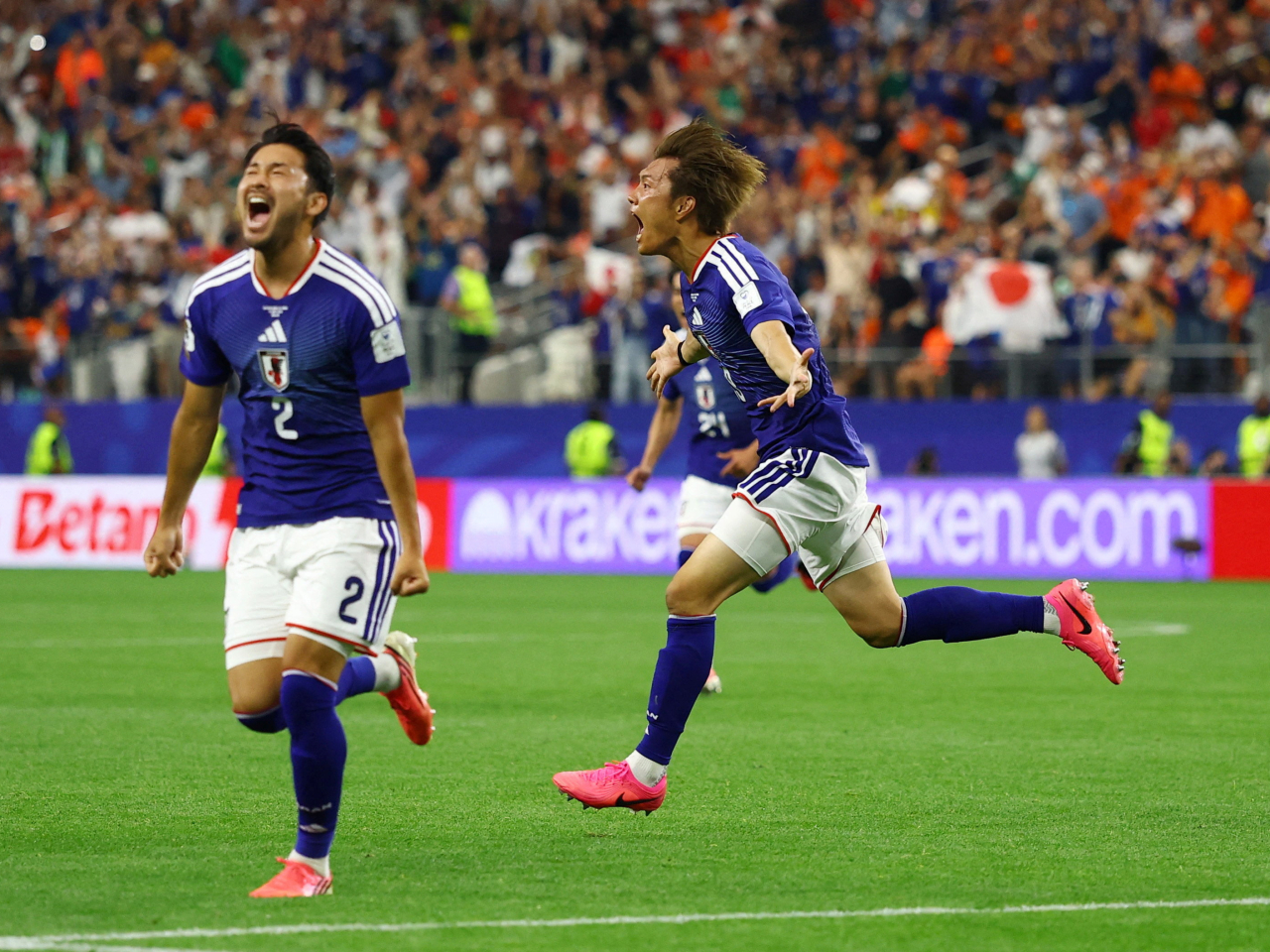 Japan players celebrate after scoring their second goal against the Netherlands. Photo: Reuters
