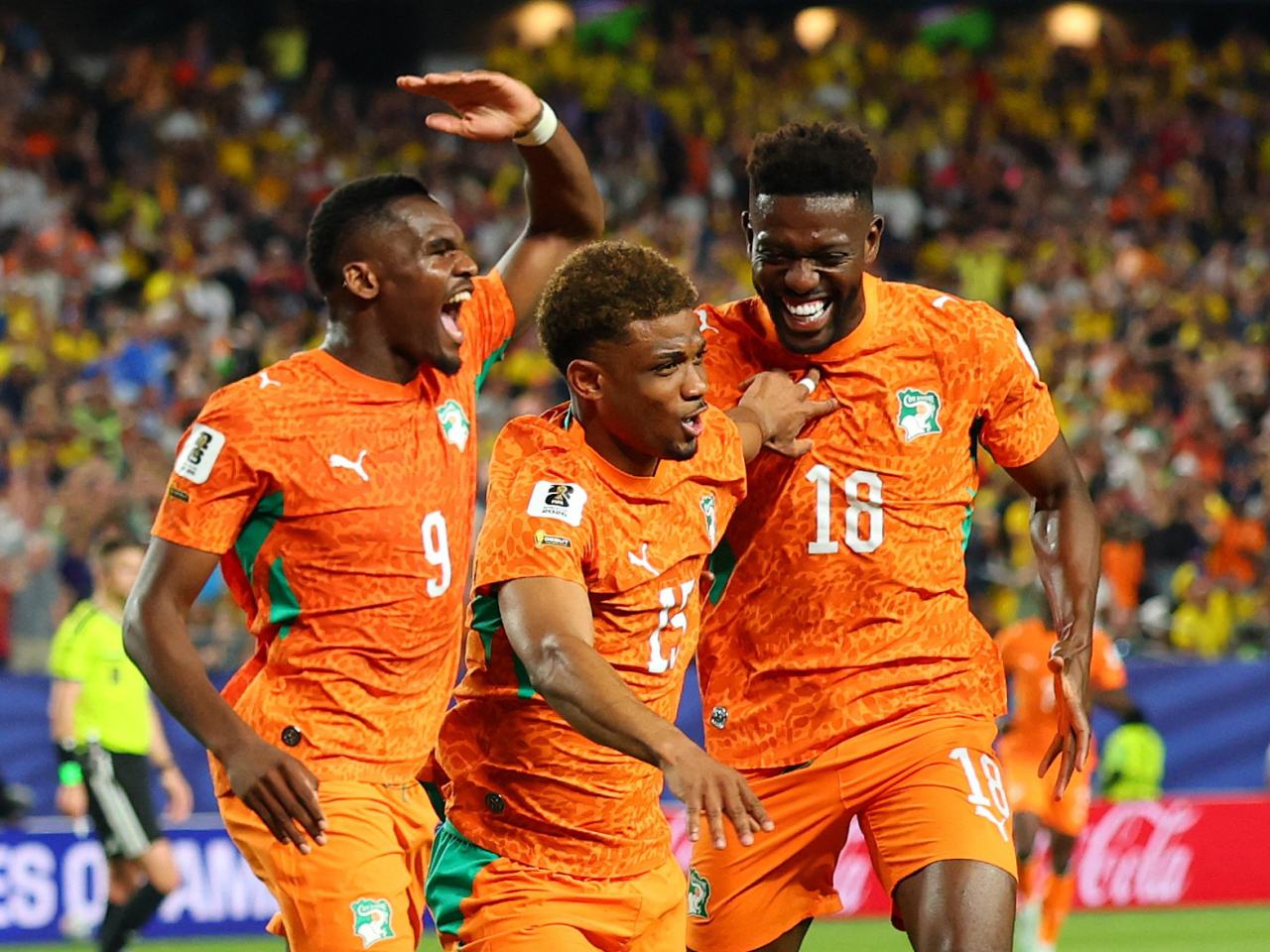 Ivory Coast's Amad Diallo celebrates scoring their first goal with Ibrahim Sangare and Ange Bonny. Photo: Reuters