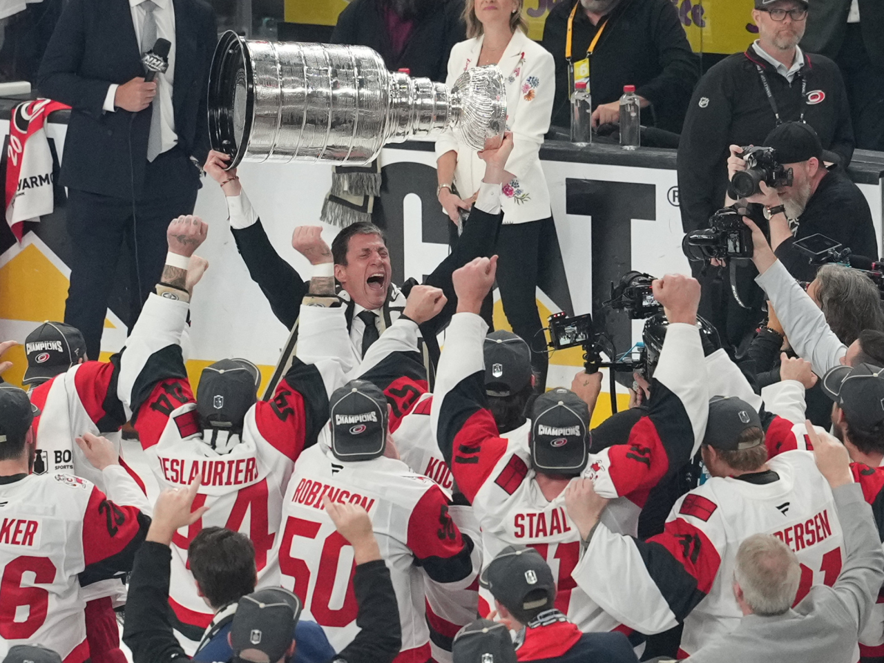 Hurricanes head coach Rod Brind'Amour celebrates holding the Stanley Cup after leading his team to victory. Photo: Reuters
