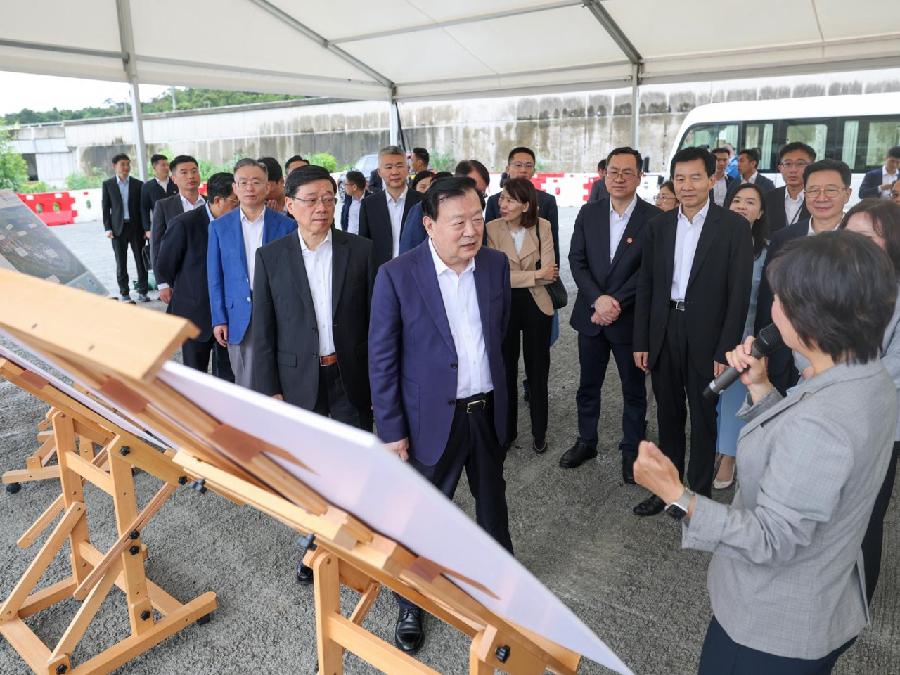 Xia Baolong (front row, second right) began the day with a visit to the Hung Shui Kiu University Town Area. Photo courtesy of the Information Services Department