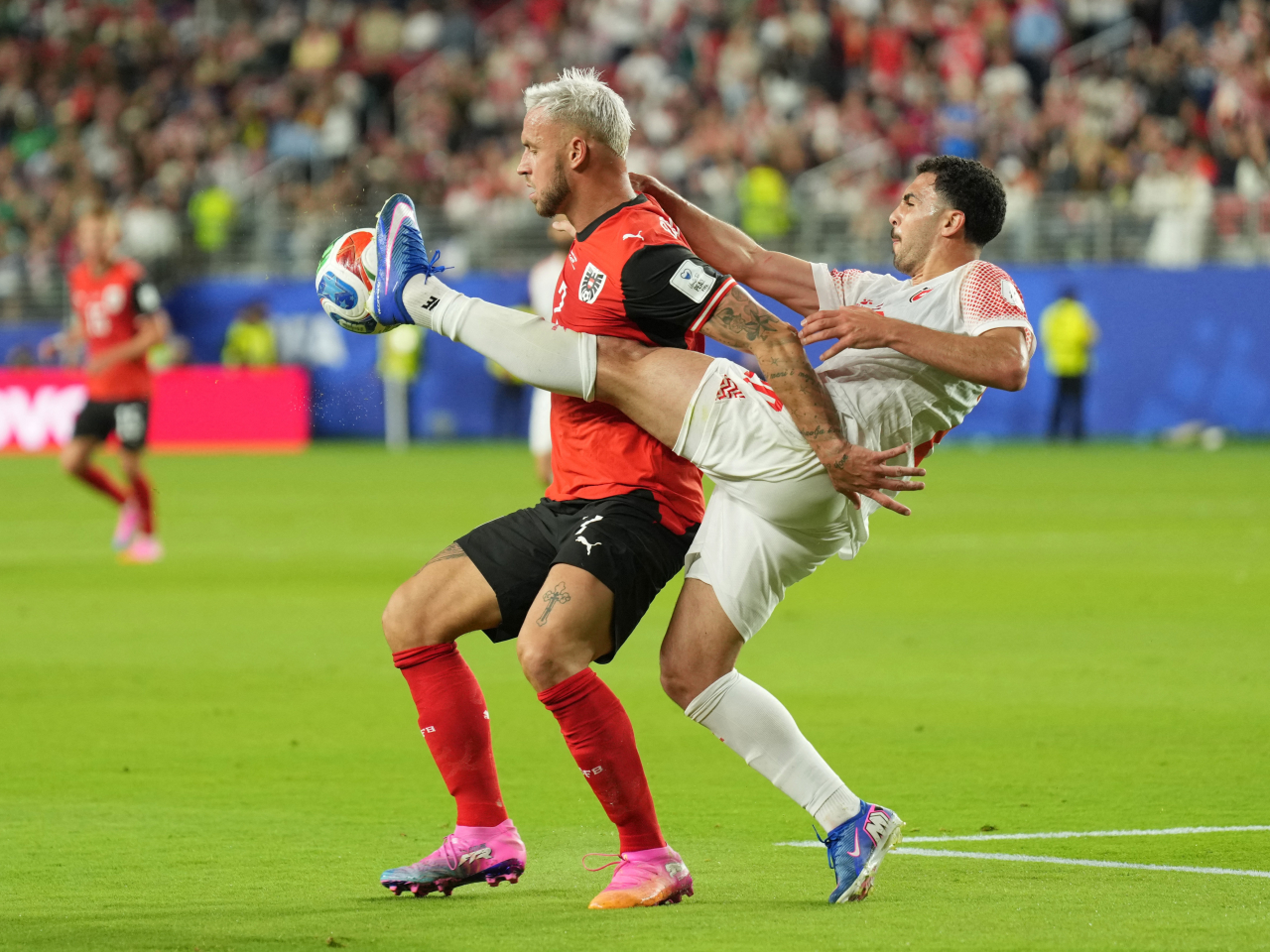 Austria's Marko Arnautovic in action with Jordan's Mohannad Abutaha. Photo: Reuters