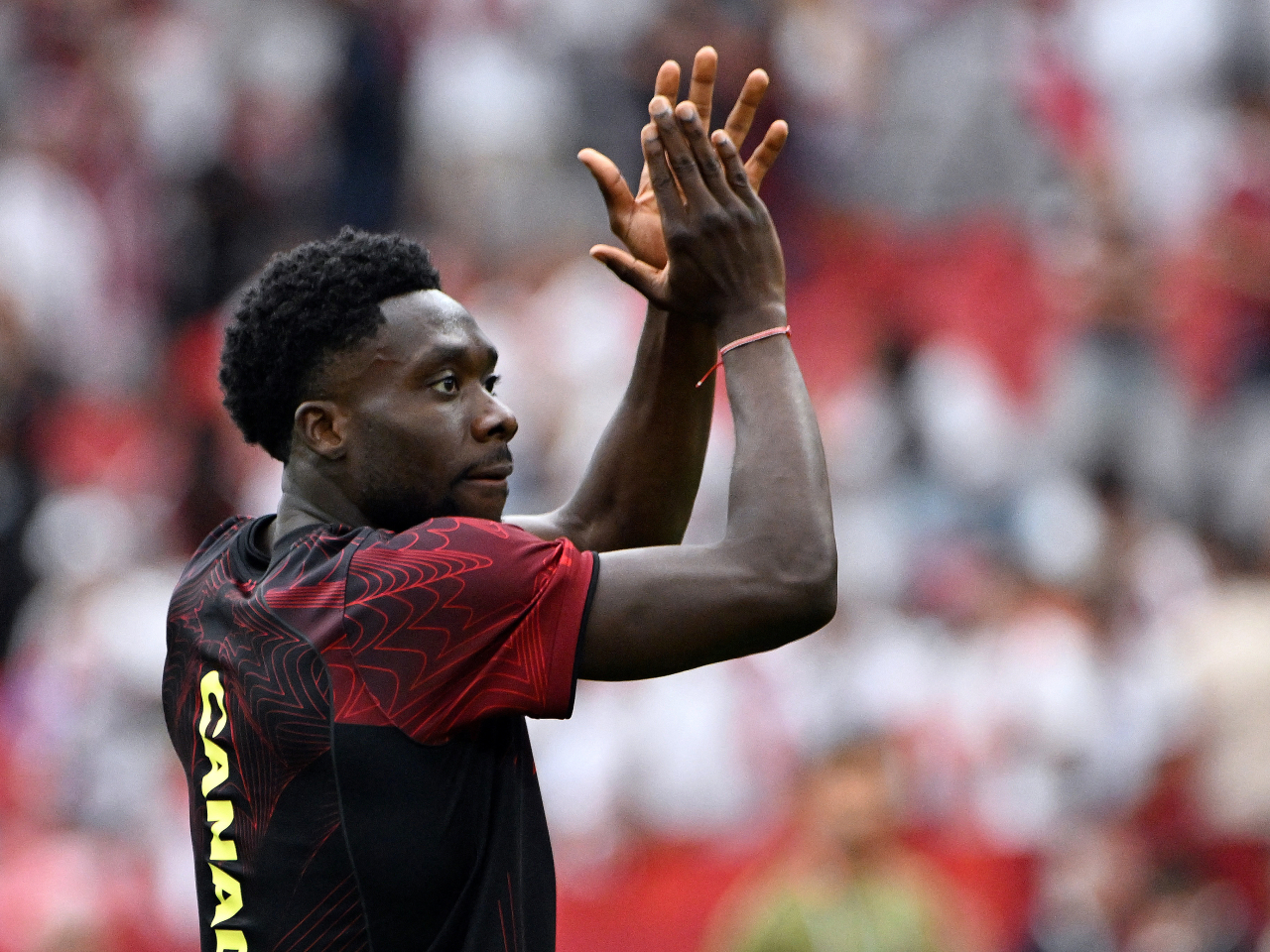 Canada's Alphonso Davies celebrates after the match. Photo: Reuters