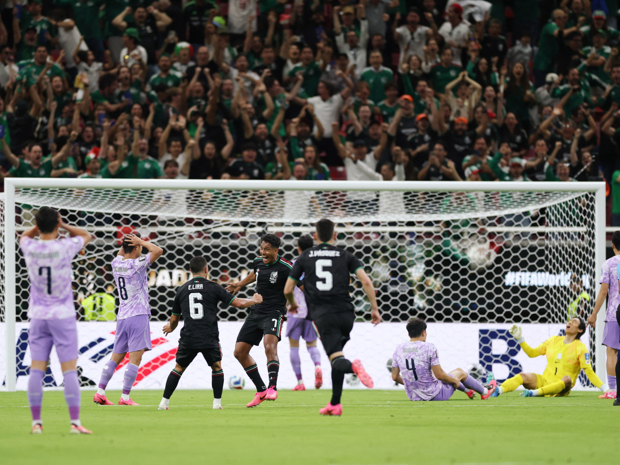 Luis Romo is left grinning ear to ear as goalie Kim Seung-gyu laments the dropped ball that cost South Korea the game. Photo: Reuters