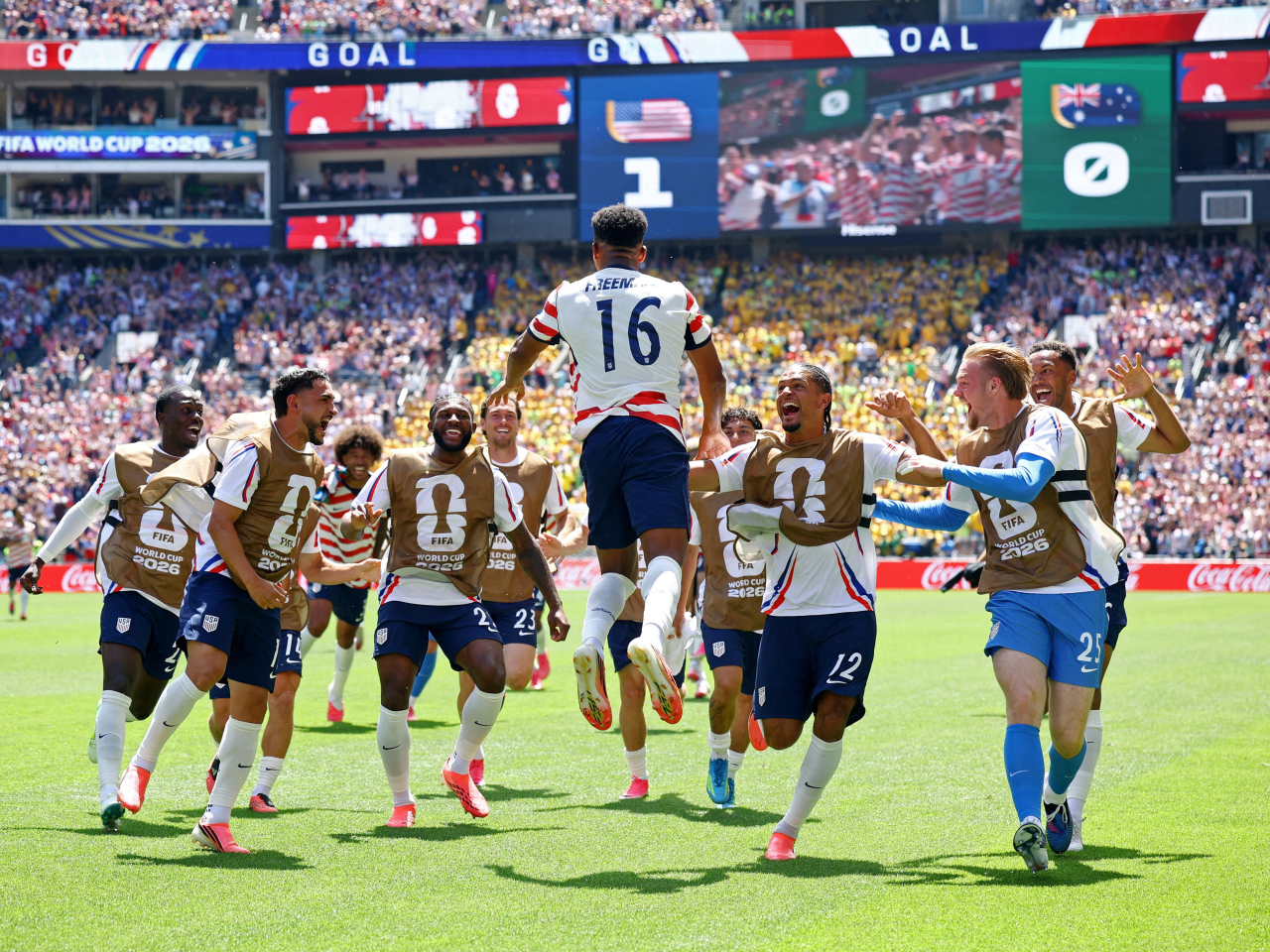 Alex Freeman celebrates with teammates after scoring his goal. Photo: Reuters