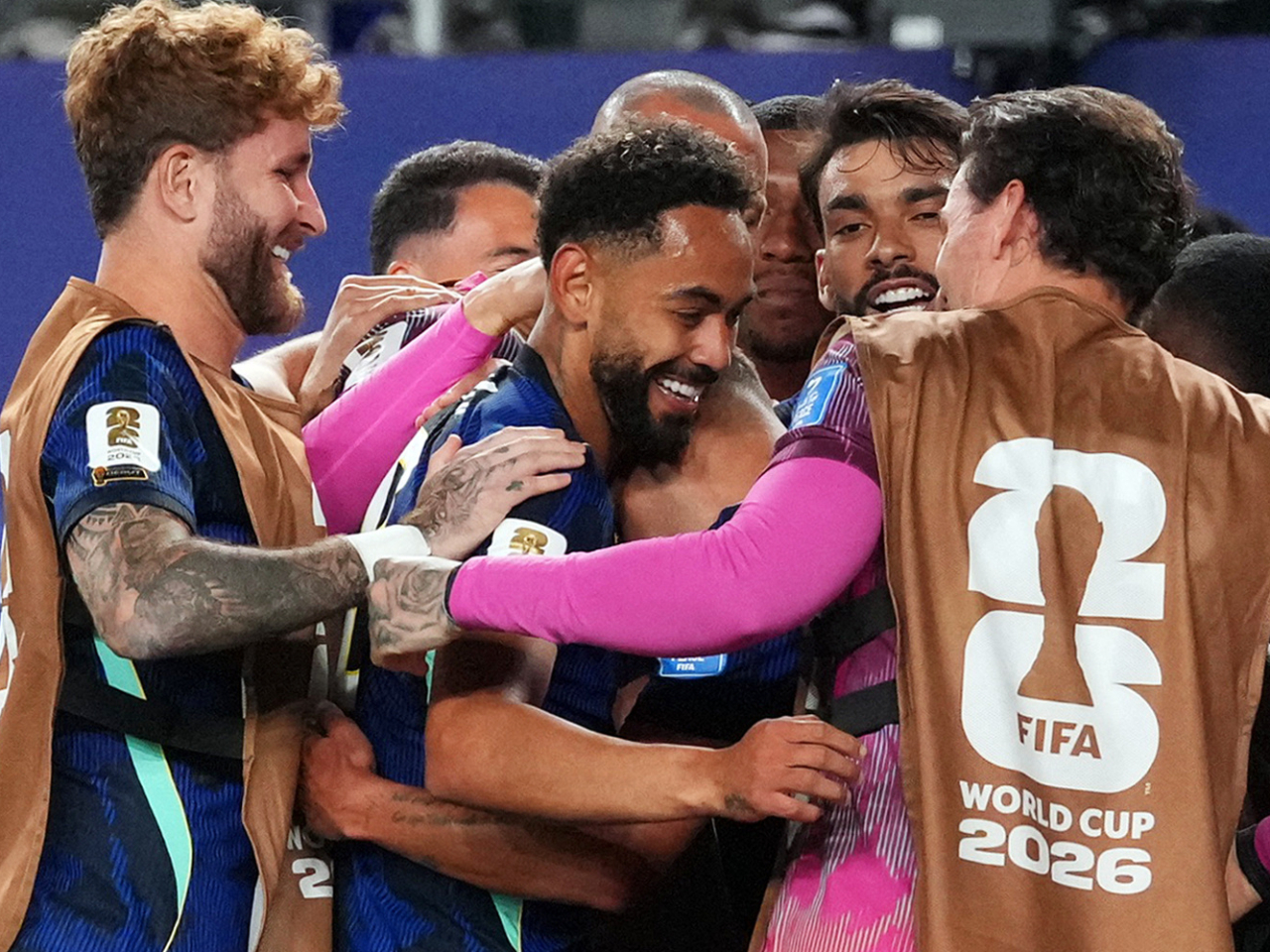 Matheus Cunha is embraced by teammates after giving Brazil the cushion of a second goal in the 3-0 win over Haiti. Photo: Reuters