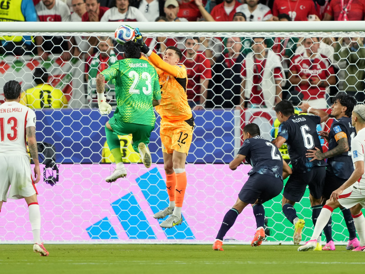 Turkiye goalkeeper Ugurcan Cakir fails to get to the ball before his Paraguay counterpart Orlando Gill does in the dying minutes. Photo: Reuters