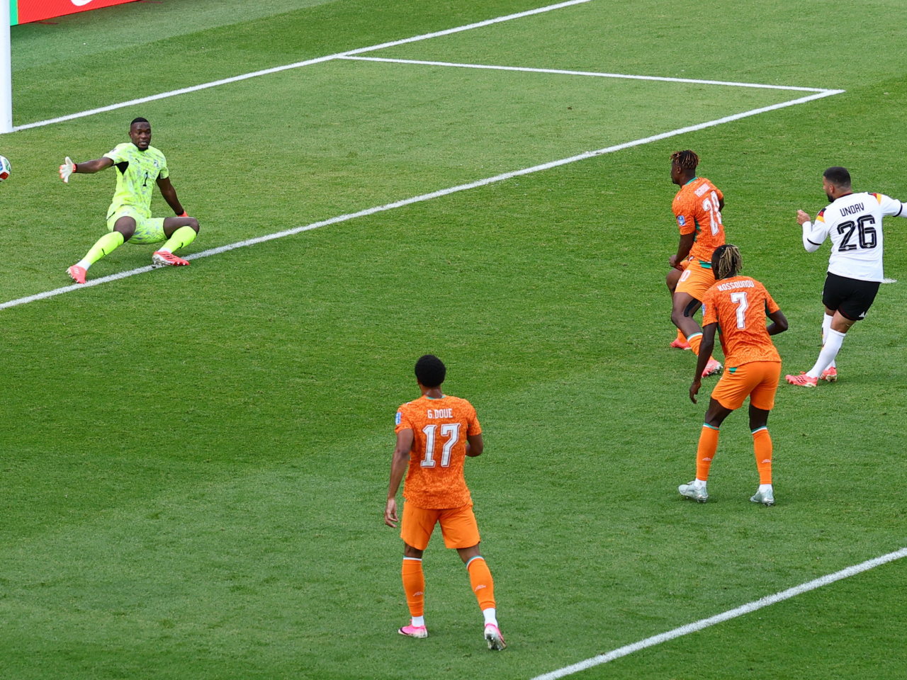 Germany's Deniz Undav scores their second goal to seal a 2-1 win over Ivory Coast and a place in the knockout round. Photo: Reuters