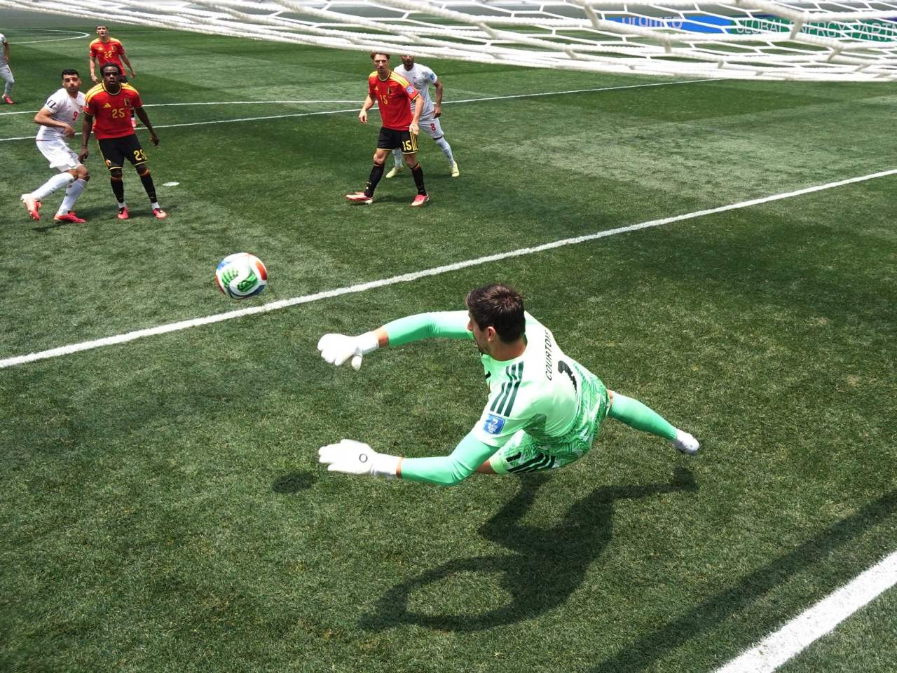 Belgium's Thibaut Courtois makes a save from Iran's Mehdi Taremi to preserve the scoreless draw. Photo: Reuters