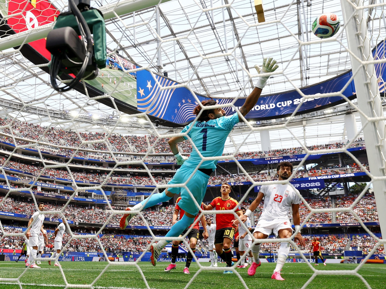 Iran's Alireza Beiranvand watch a shot from Belgium's Dodi Lukebakio go wide. Photo: Reuters
