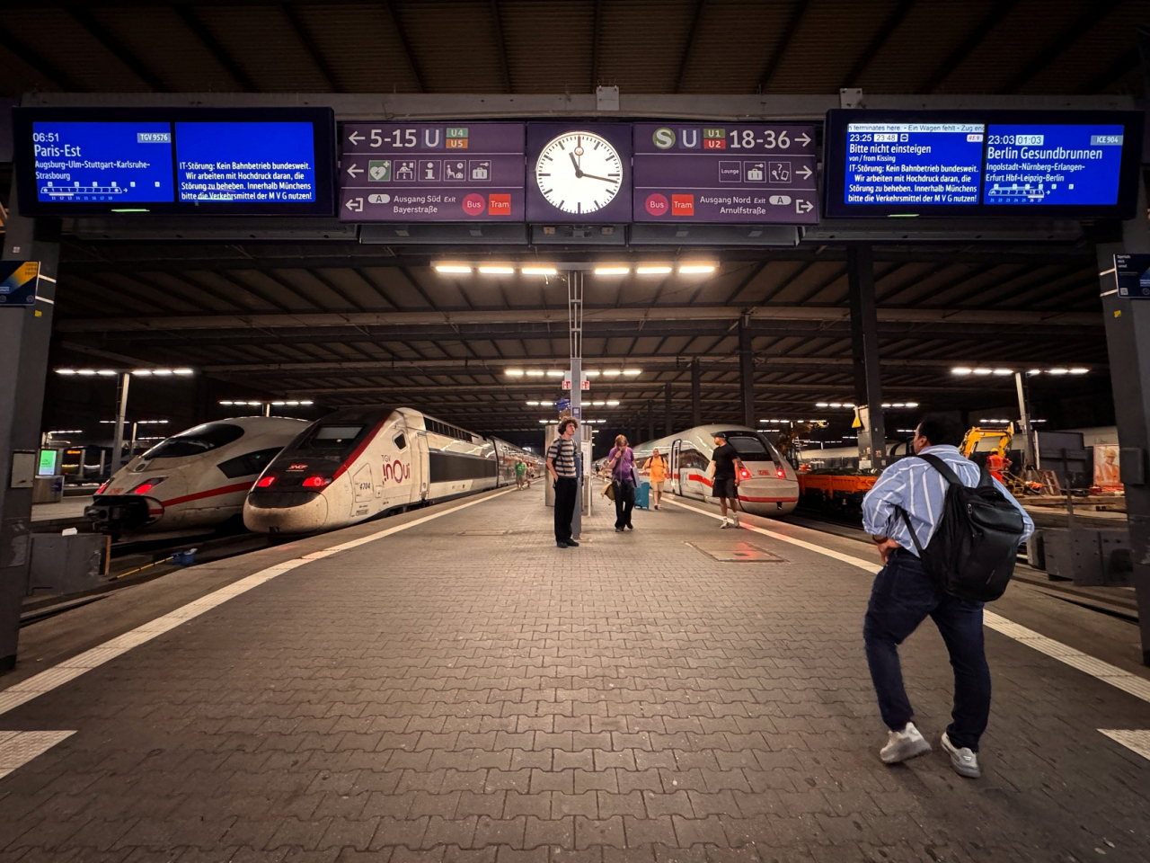 Information screens display messages advising passengers not to enter trains at platforms of the main train station in Munich. Photo: Reuters