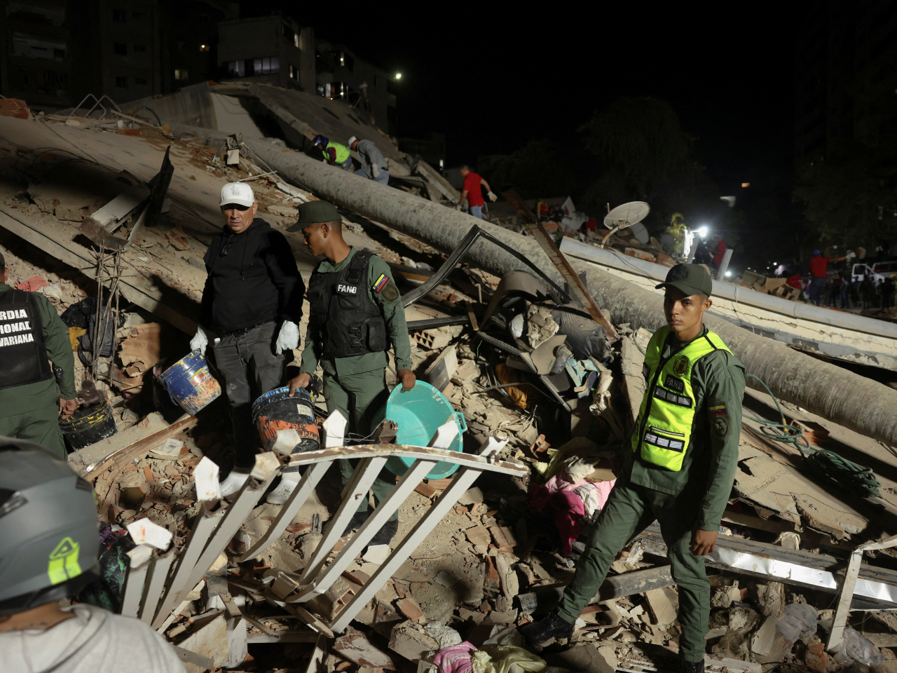 Emergency services work at the site of a collapsed building after an earthquake in Caracas, Venezuela. Photo: Reuters