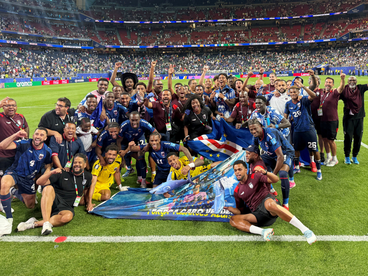 Cape Verde players and staff celebrate after the small country of under 500,000 people qualify for the knockout stages. Photo: Reuters