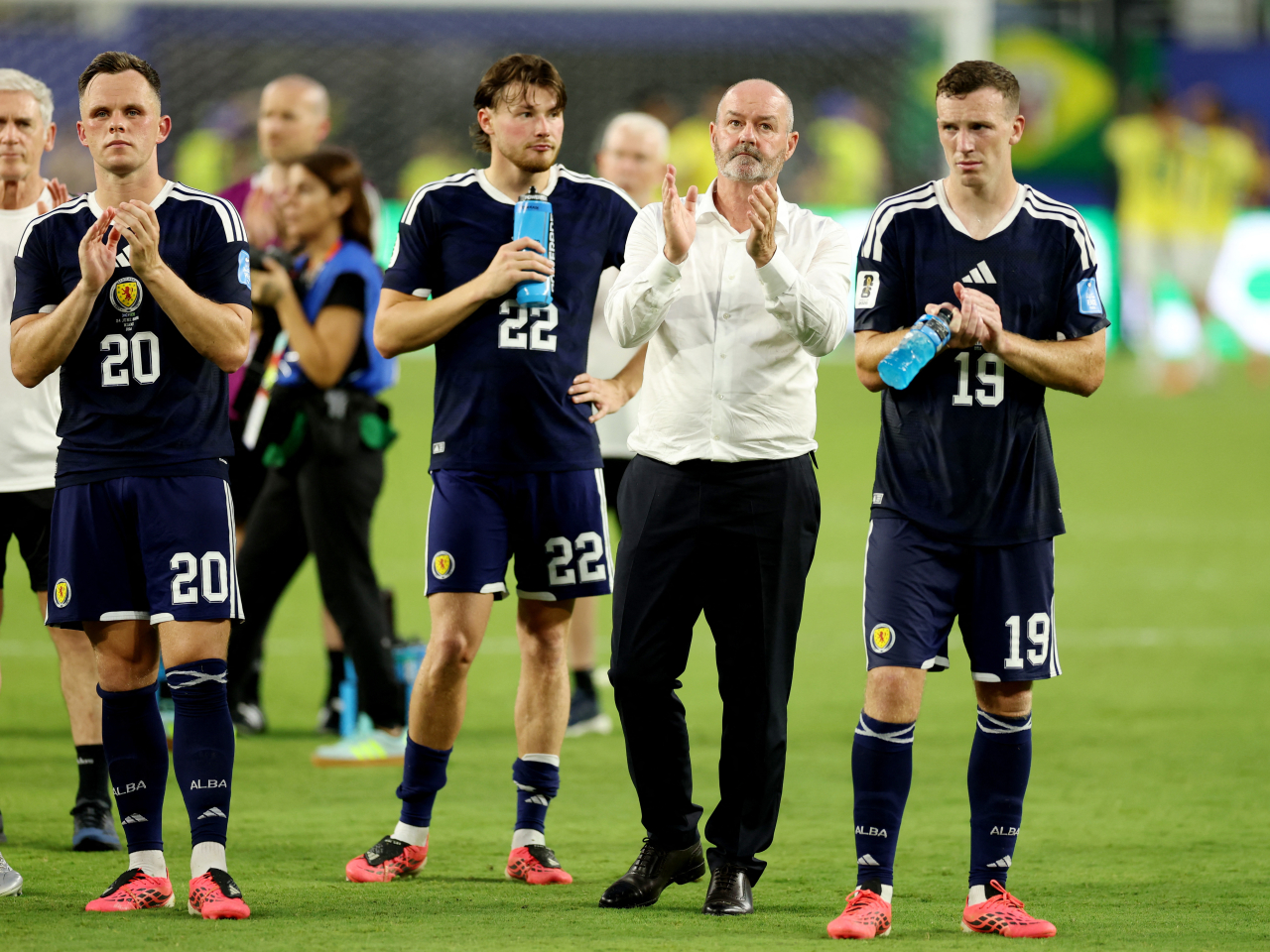 Scotland manager Steve Clarke and Scottish players applaud the fans after their loss to Brazil which effectively eliminated them from the tournament. Photo: Reuters