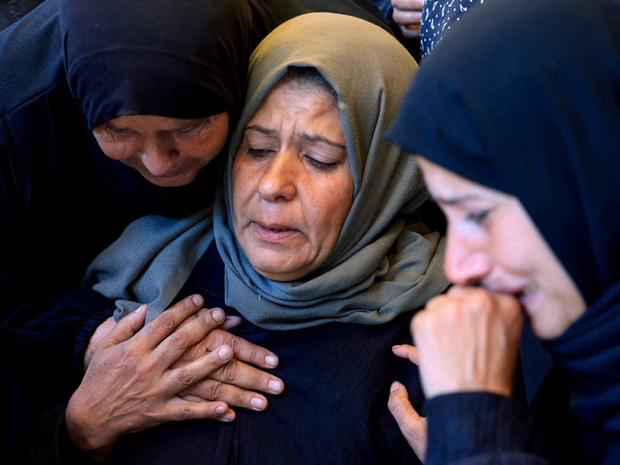 Mourners attend the funeral of Palestinian girl Alin Al-Farra, who was killed in an Israeli strike. Photo: Reuters