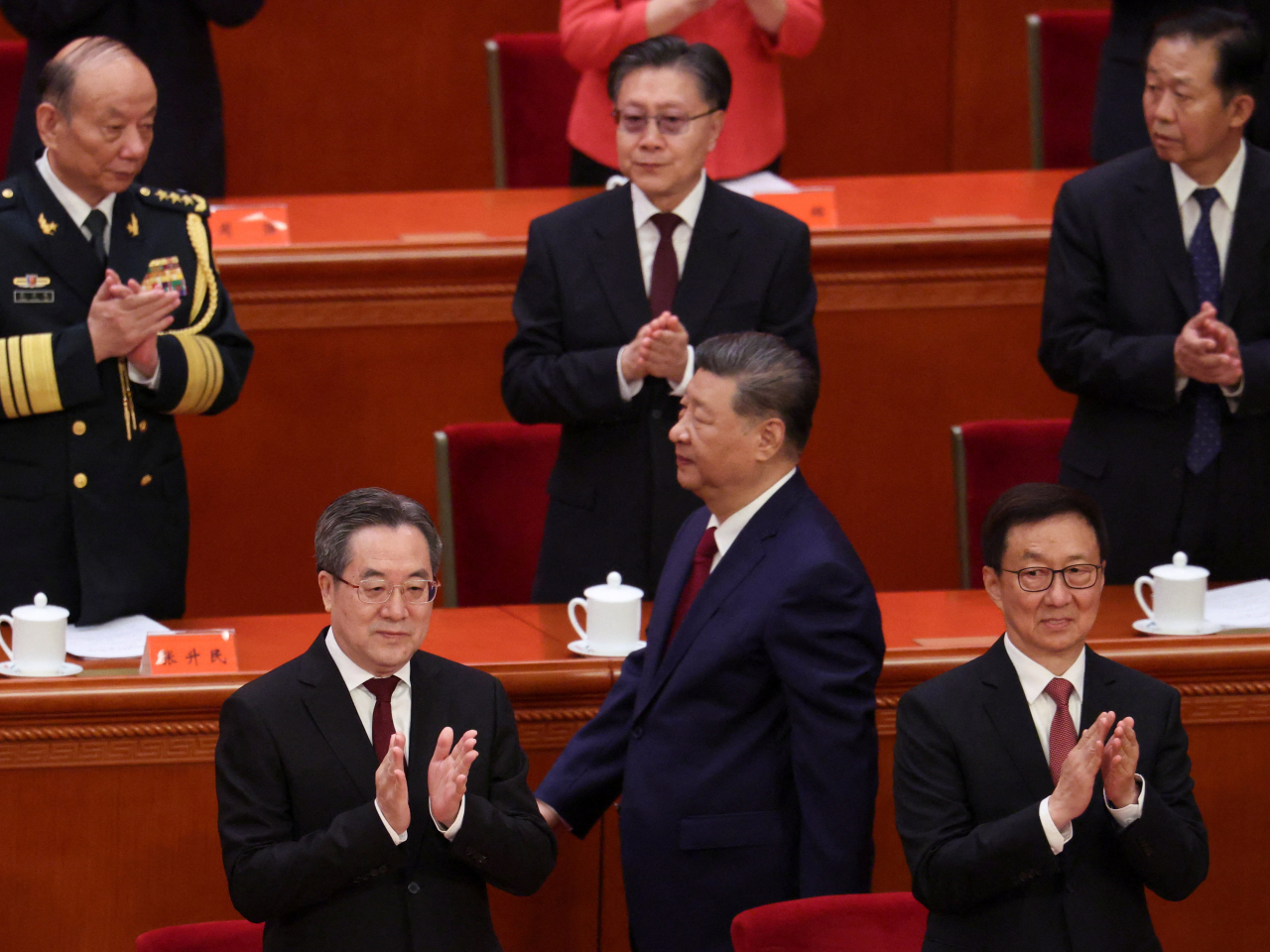 Xi Jinping is applauded as he arrives at the Great Hall of the People for the 105th anniversary of the Communist Party of China. Photo: Reuters