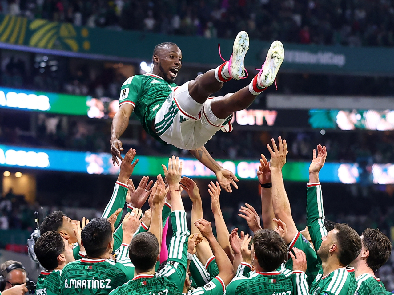 Mexican players celebrate with man of the match Julian Quinones. Photo: Reuters