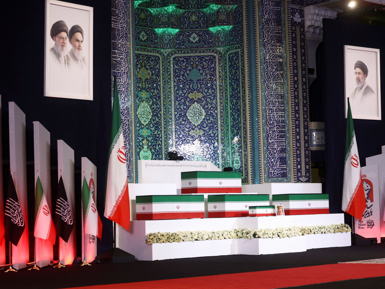 The coffins of Ali Khamenei and four family members are put on stage at the Imam Khomeini Grand Mosalla in Tehran. Photo: Reuters
