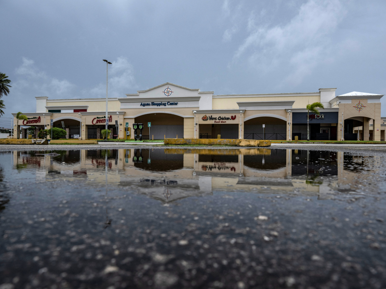 There were few cars on the roads in Guam on Sunday as heavy rain and strong winds lashed the island. Photo: AFP
