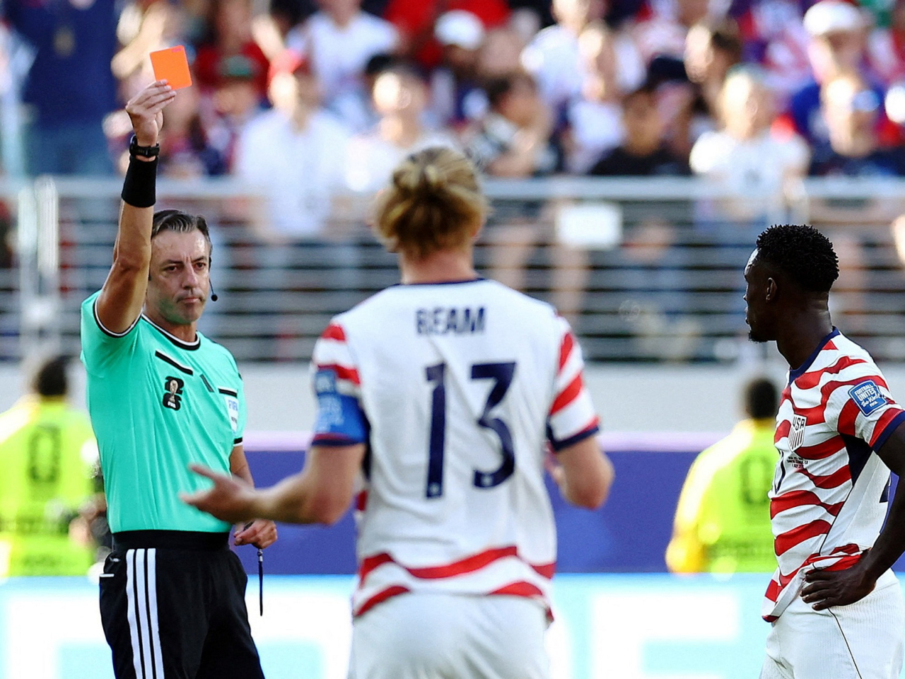 Folarin Balogun is shown a red card by referee Raphael Claus. Photo: Reuters