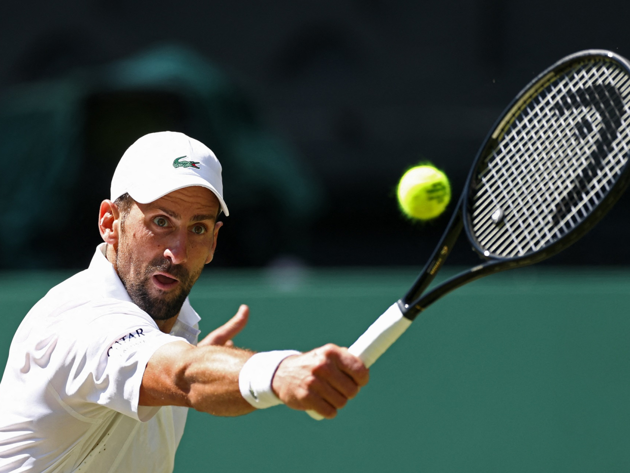 Novak Djokovic set a Wimbledon record with his 106th singles win, breaking Roger Federer&rsquo;s all-time men&rsquo;s record. Photo: Reuters