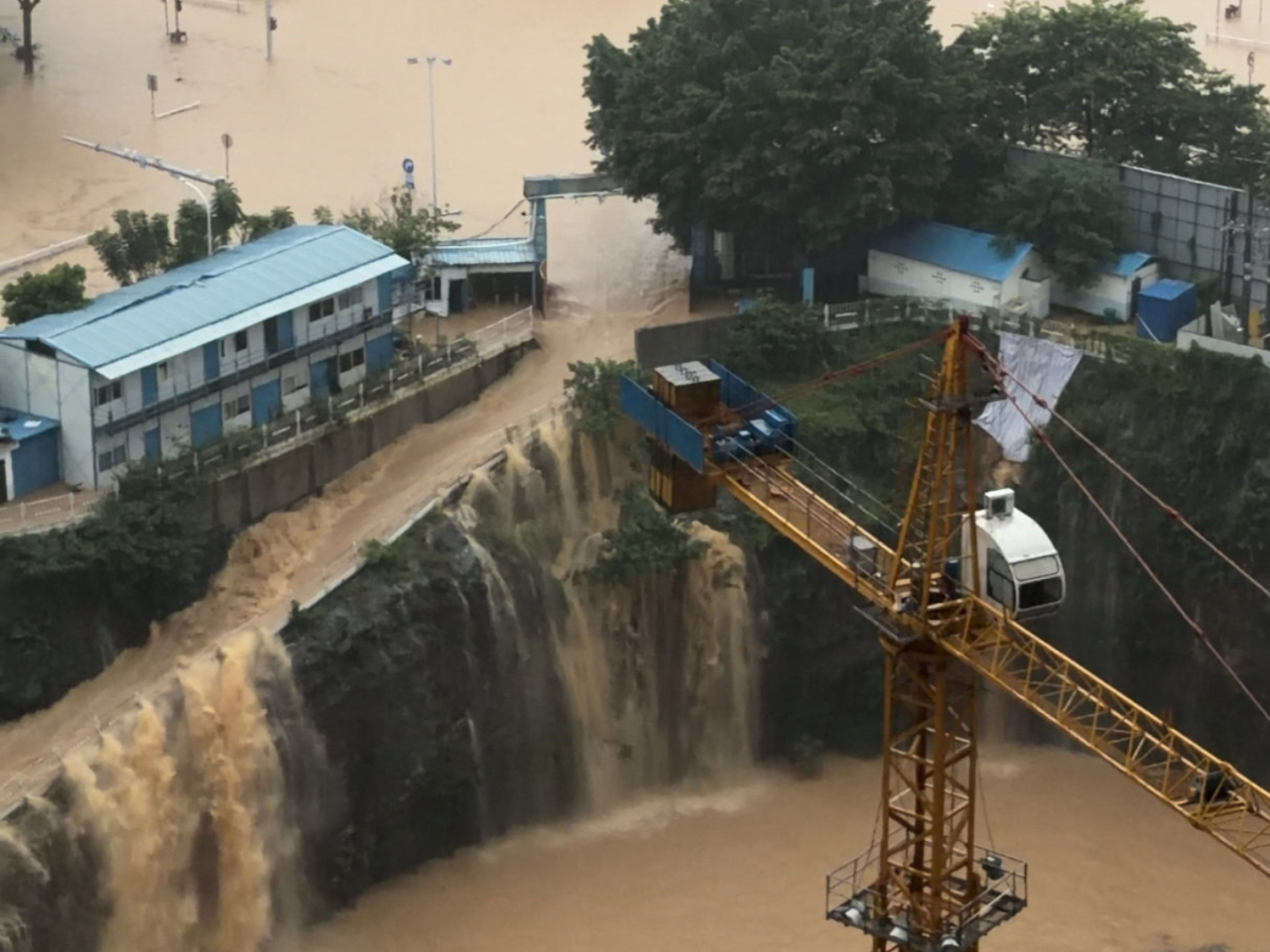Floodwater pours into a construction site in Guiyang, Guangxi, amid a deluge in the aftermath of Maysak. Photo: Reuters