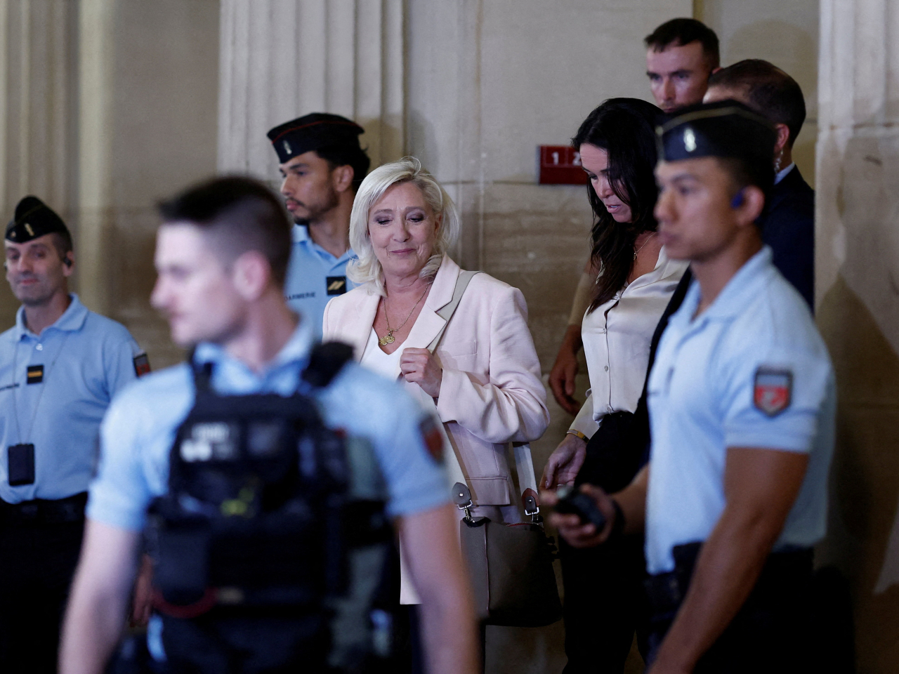 Marine Le Pen was smiling as she left the courtroom, but did not say a word. Photo: Reuters