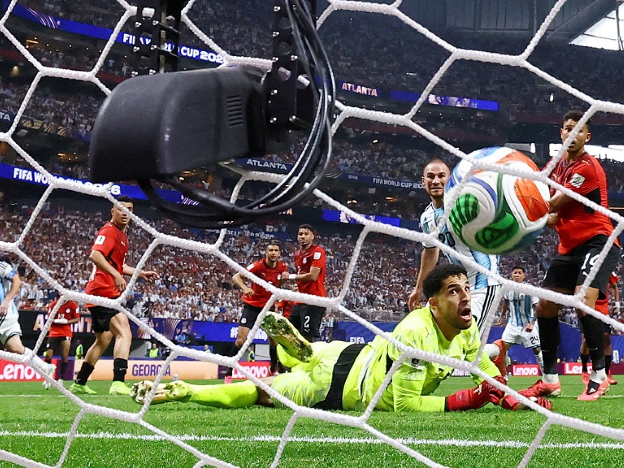 Egyptian keeper Mostafa Shoubir is left stunned by Lionel Messi's 21st World Cup goal. Photo: Reuters