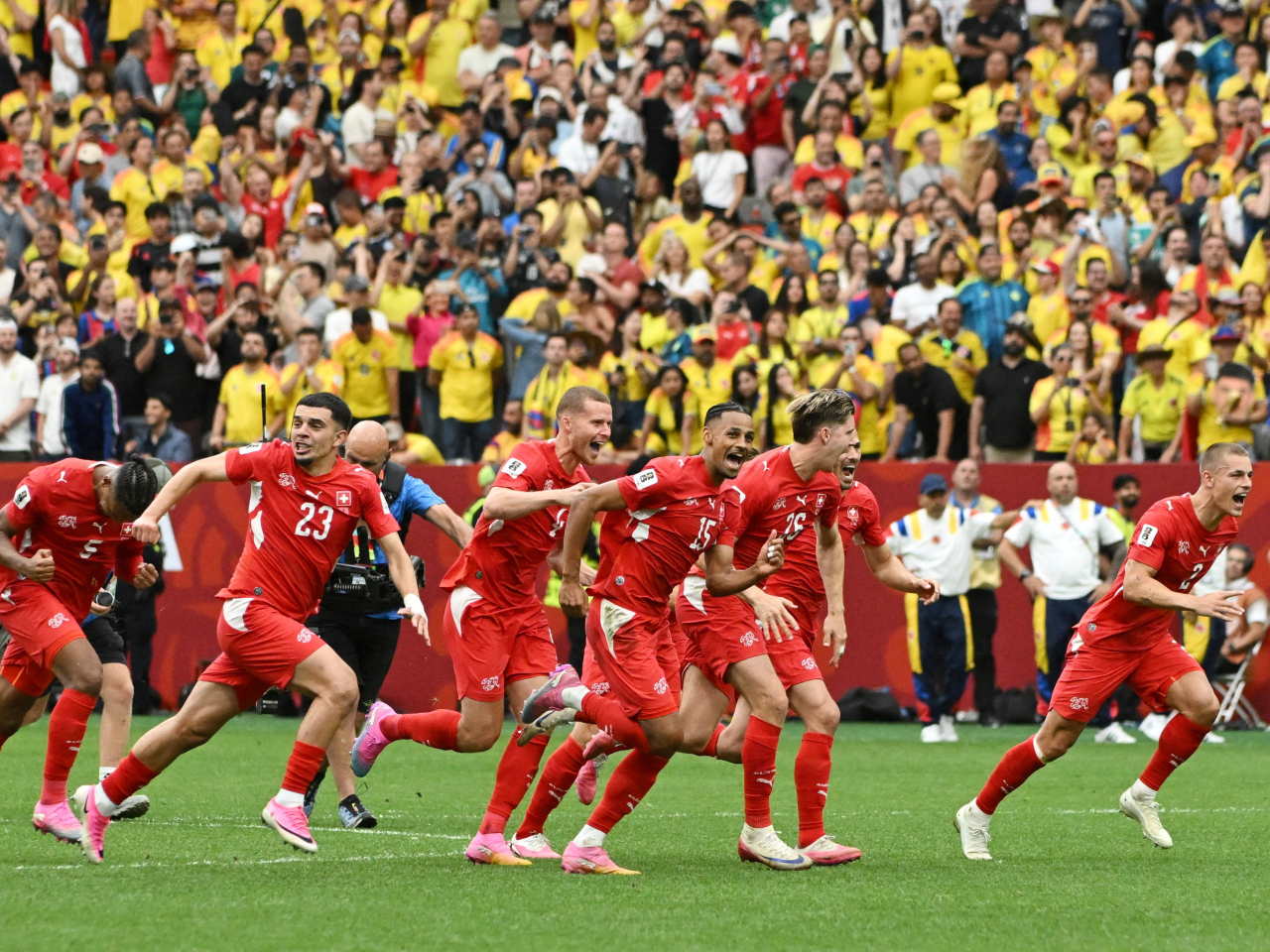 Swiss players celebrate after winning on penalties against Colombia. Photo: Reuters