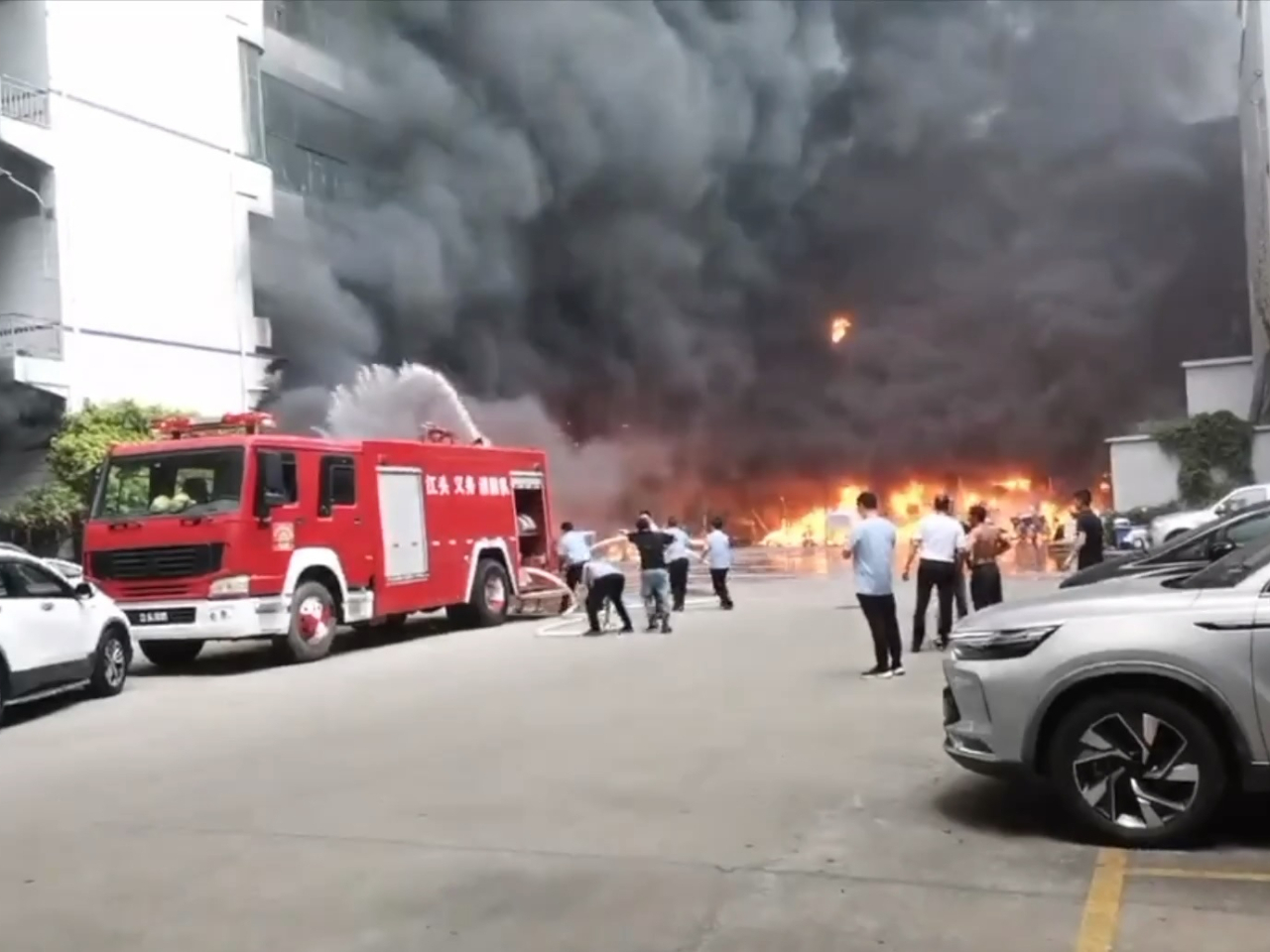 Firefighters battle the blaze in the city of Jinjiang. CCTV screengrab