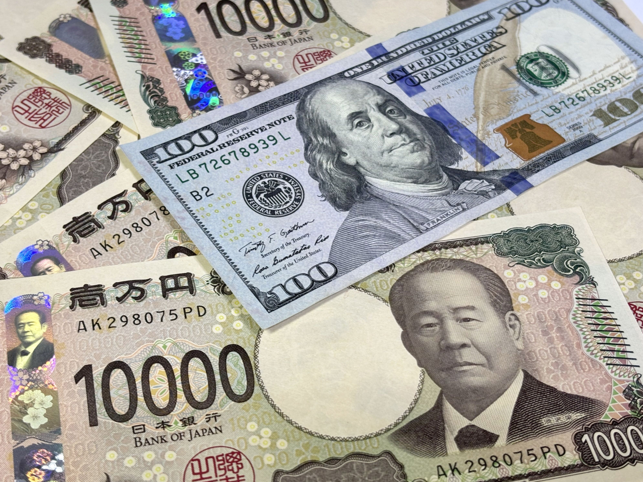 美元指數連續兩日向下，美元兌日圓下跌0.18%，報162.3日圓。（港台圖片）