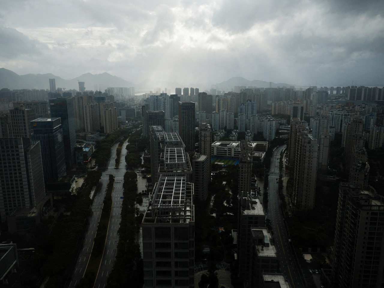 Rain clouds shroud downtown Wenzhou as Typhoon Bavi approaches. Photo: Reuters
