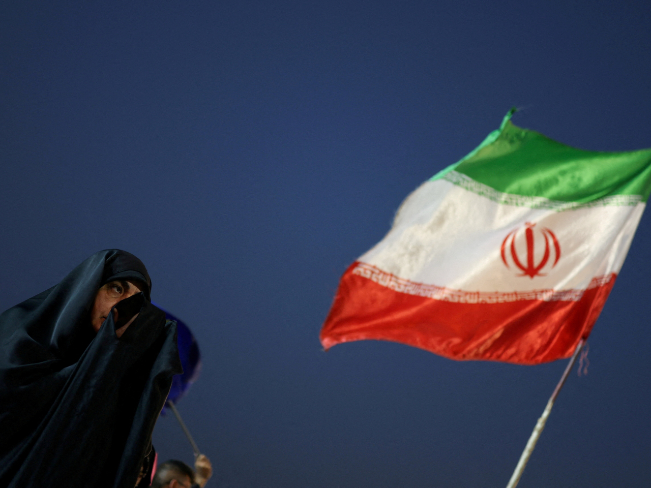An Iranian woman prays ahead of a farewell ceremony for Iran's late Supreme Leader Ayatollah Ali Khamenei, in Tehran, July 2, 2026. File photo: Reuters