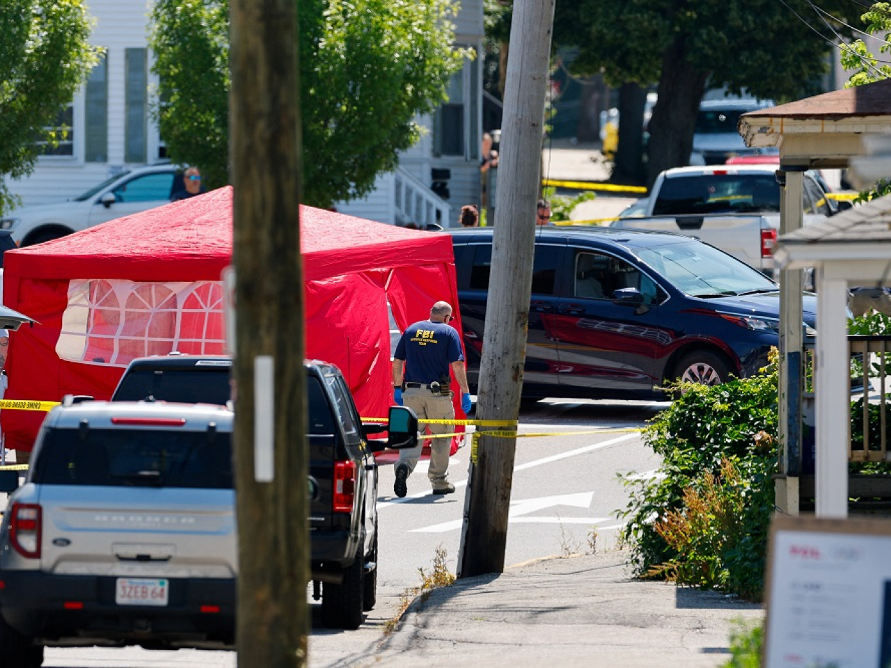 A witness said he saw ICE agents had pulled a person out from a white car after hearing gunshots. Photo: Reuters