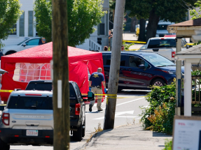 A witness said he saw ICE agents had pulled a person out from a white car after hearing gunshots. Photo: Reuters