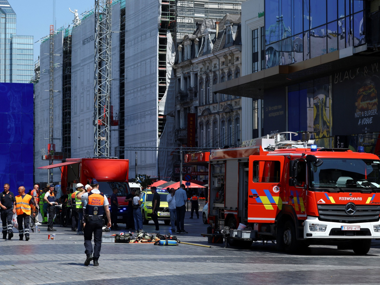 Firefighters battle the blaze at the renovation project in the Belgian capital. Photo: Reuters
