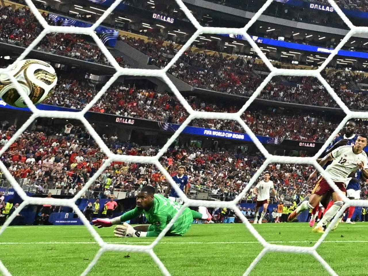Pedro Porro smashes the ball past Mike Maignan to send Spain into the World Cup final. Photo: Reuters