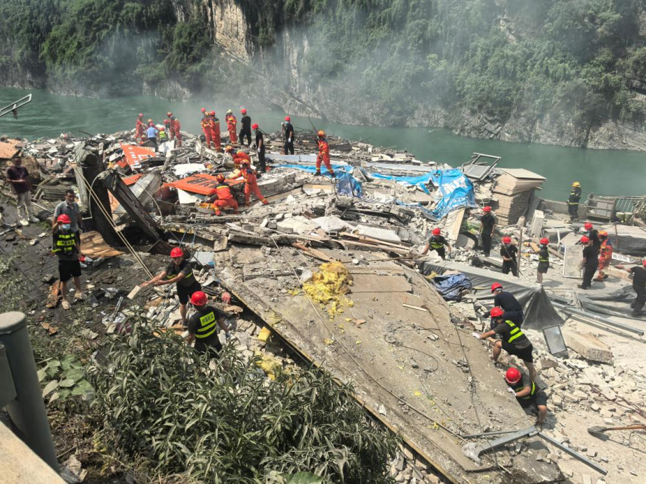 Rescuers search for survivors at the site of the landslide in Chongqing. Photo: handout via Xinhua
