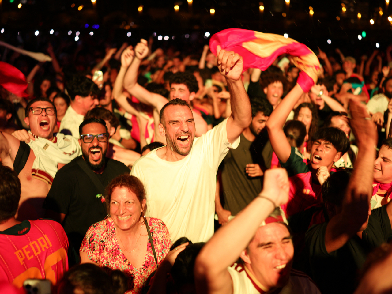 Spanish fans erupt in celebration after watching their side take the lead against Argentina. Photo: Reuters