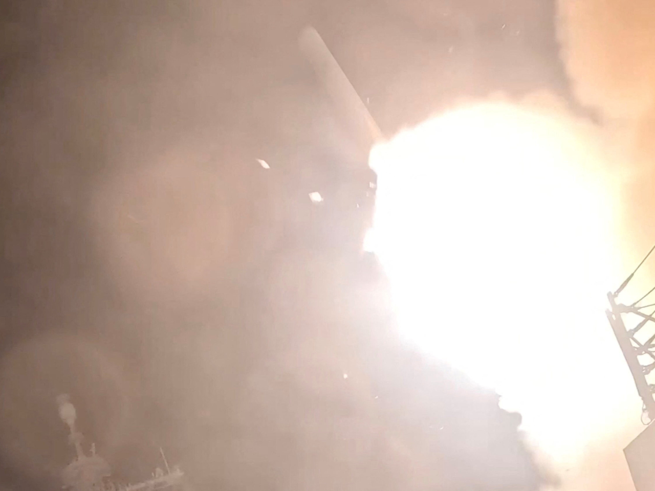 A munition is launched from a US warship at an unknown location, during what US Central Command says are strikes on Iran. Photo: Reuters