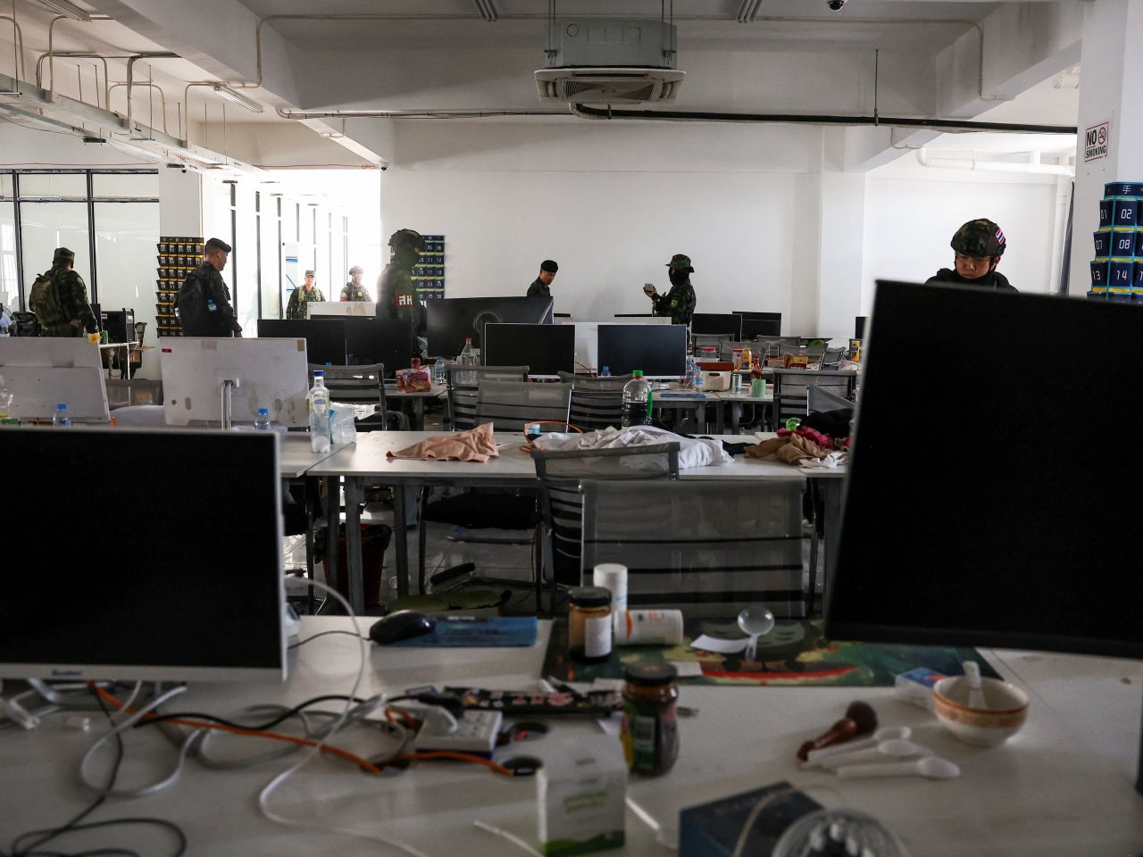 Thai soldiers go through a scam farm where online fraudsters wreak financial devastation on the unsuspecting. File photo: Reuters